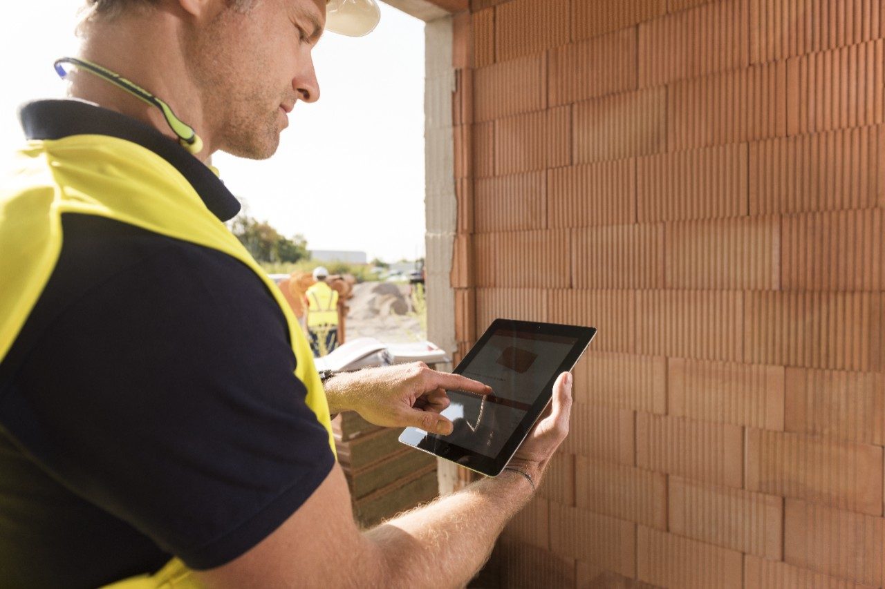 Construction worker with tablet computer