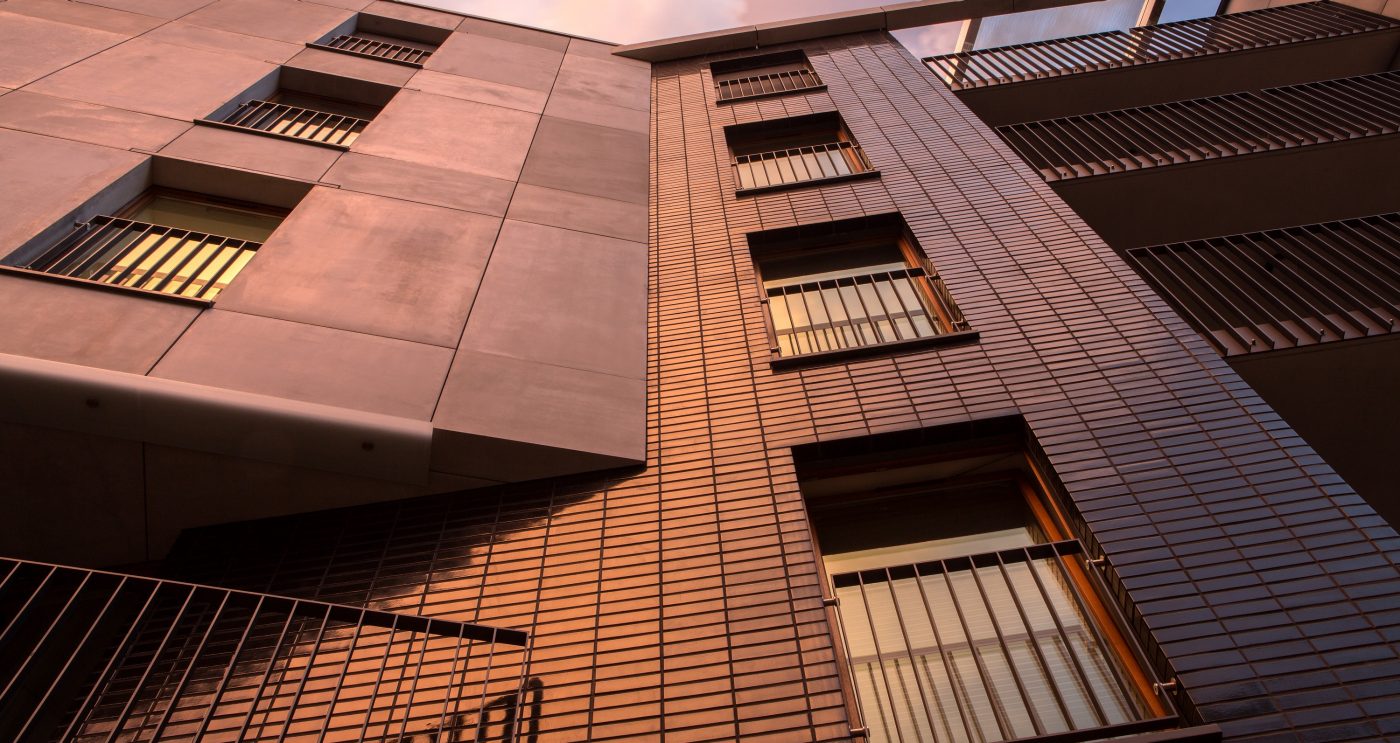 Multifamily setting with black glazed facing brick slips in Crakow